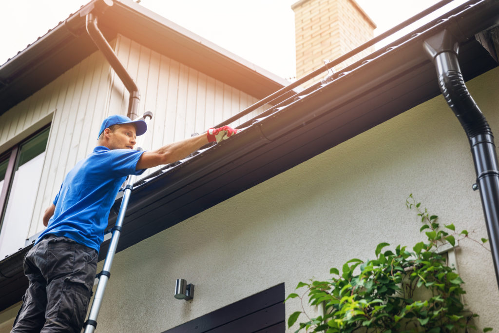 Man cleaning gutters | Exterior Repairs | Outdoor Repairs | Hands You Demand